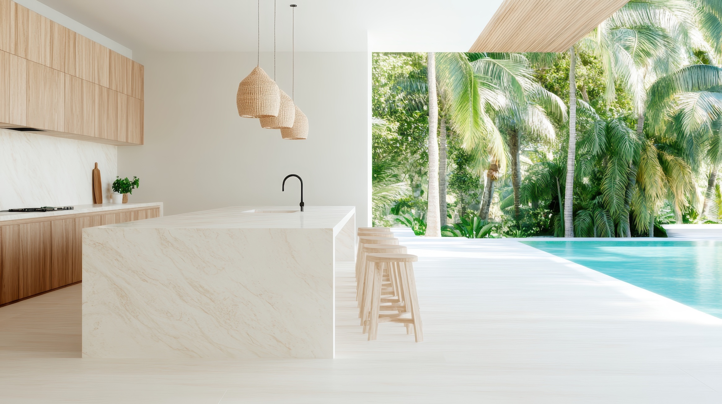 Seamless indoor-outdoor living space with a bright minimalist kitchen that opens directly to a pool and tropical landscaping.